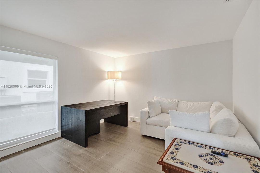 Versatile second bedroom suite, perfect as a guest retreat, sophisticated office, or elegant flex space tailored to your lifestyle.