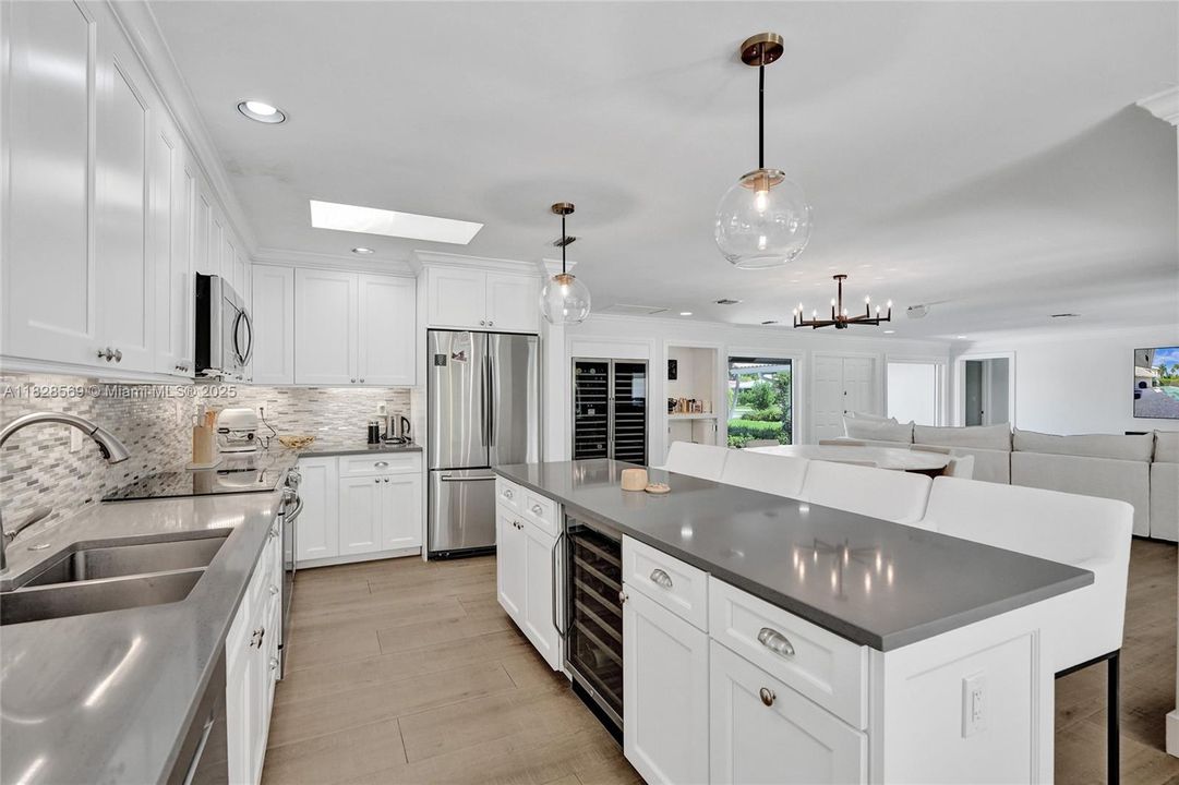 Compact built-in wine fridge conveniently located in the kitchen — perfect for easy access and everyday use.