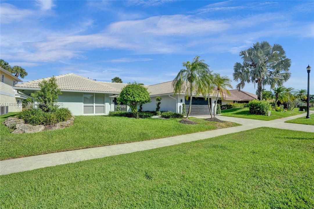 New installed landscaping, bushes, and grass.