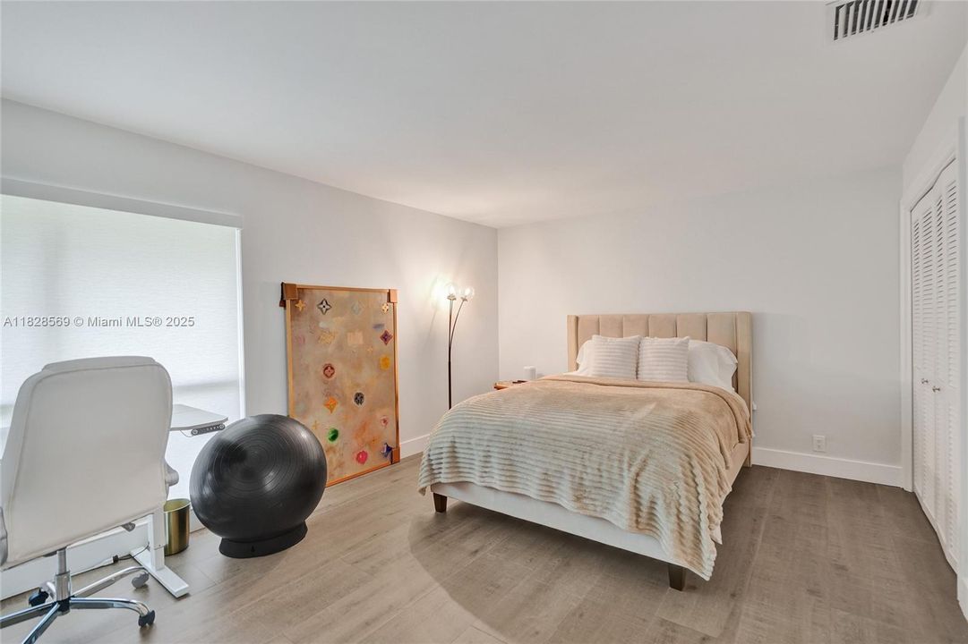 Spacious third bedroom offering comfort and versatility, ideal for family, guests, or a personalized retreat.