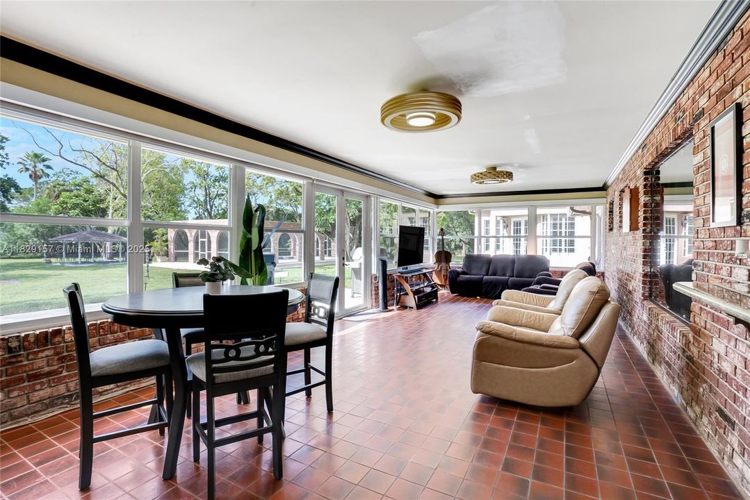 Florida room with view of the pool & backyard