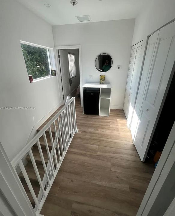 Laundry closet located in hallway