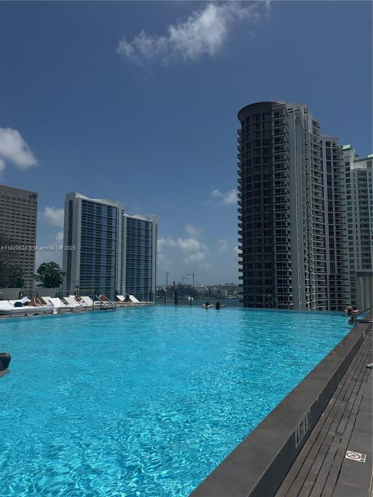 Resort-style infinity pool overlooking Brickell Key and the bay — the perfect escape for relaxation or entertaining with iconic views.