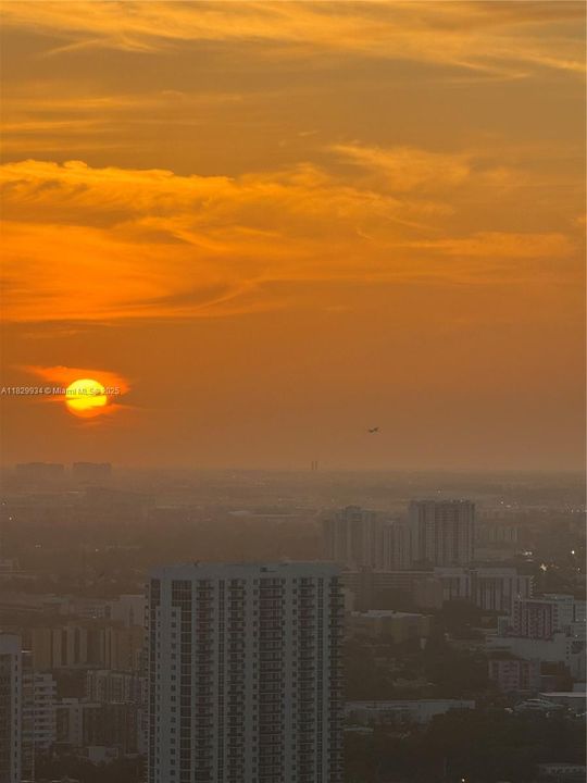 Warm sunset hues paint the horizon — a breathtaking northwest view capturing the magic of Miami’s evenings.