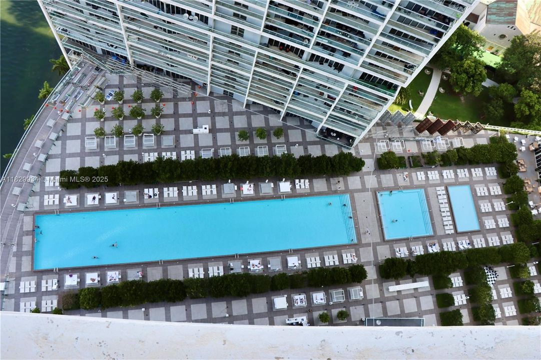 Stunning aerial perspective of the world-renowned Icon Brickell pool deck — Miami luxury redefined from above.