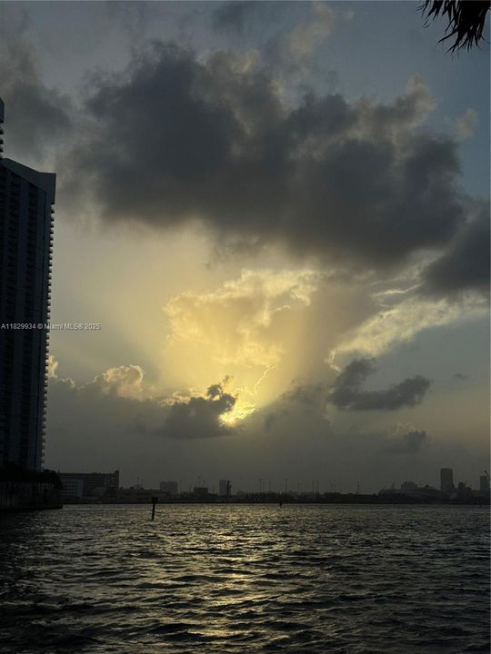 Golden sunrise over Biscayne Bay — a daily masterpiece of color and light as the city awakens.