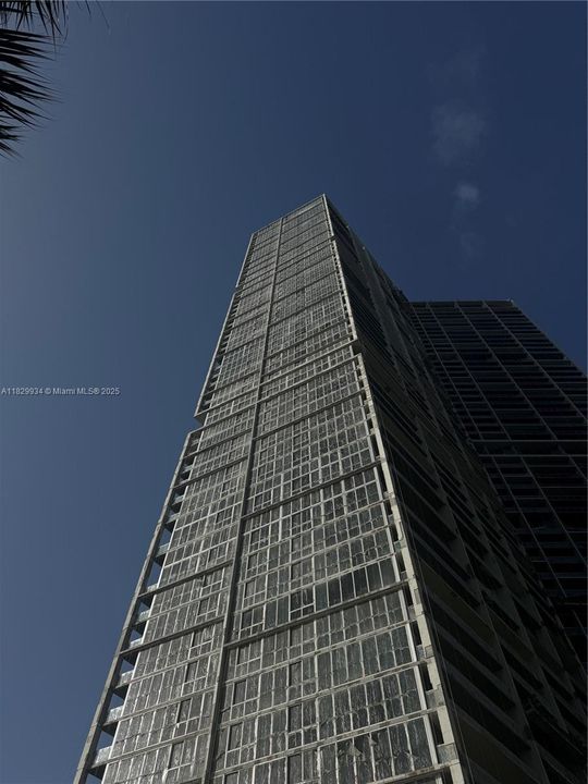 Dramatic upward angle capturing Icon Brickell’s bold lines and striking scale against the South Florida sky.