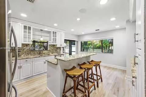 Chef's dream kitchen where white cabinets meet granite glamour!