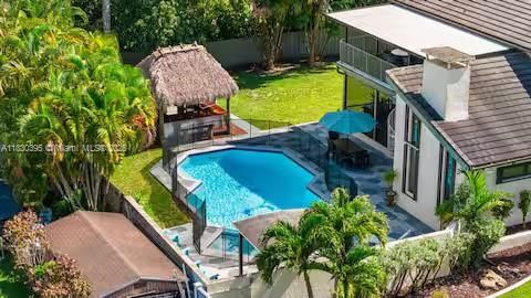 Aerial shot of complete backyard paradise with tiki bar!