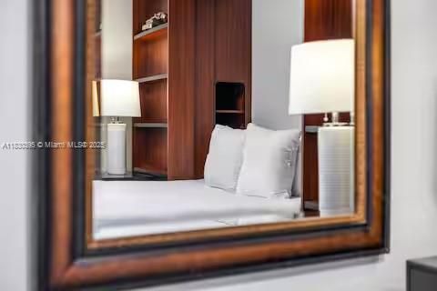 Mirror reflection of modern bedroom perfection!