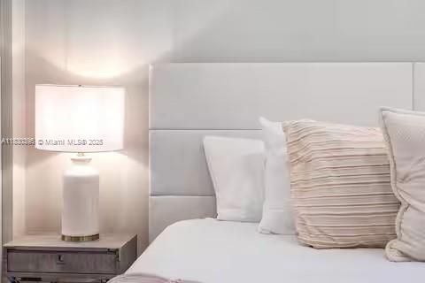 Tufted headboard luxury with soft neutral tones!