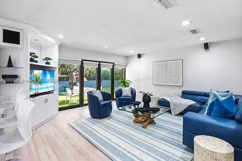 Modern meets tropical in this sleek blue and white paradise!