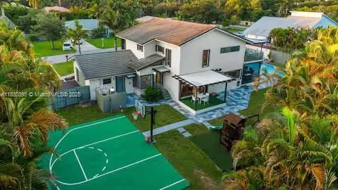Backyard paradise with basketball court and pool!