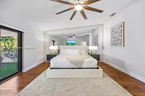 Mirror-backed bed creates dramatic bedroom focal point!