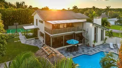 Sunset drone view of modern tropical estate!