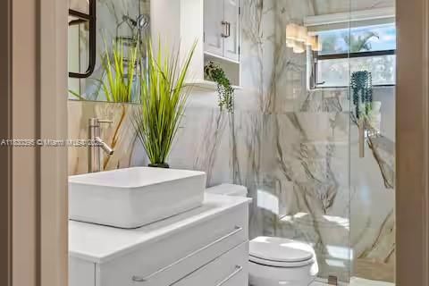 Marble bathroom paradise with vessel sink glamour!