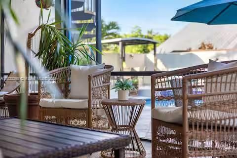 Rattan outdoor furniture creates tropical deck vibes!