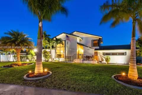 Palm-lined driveway leads to contemporary luxury home!