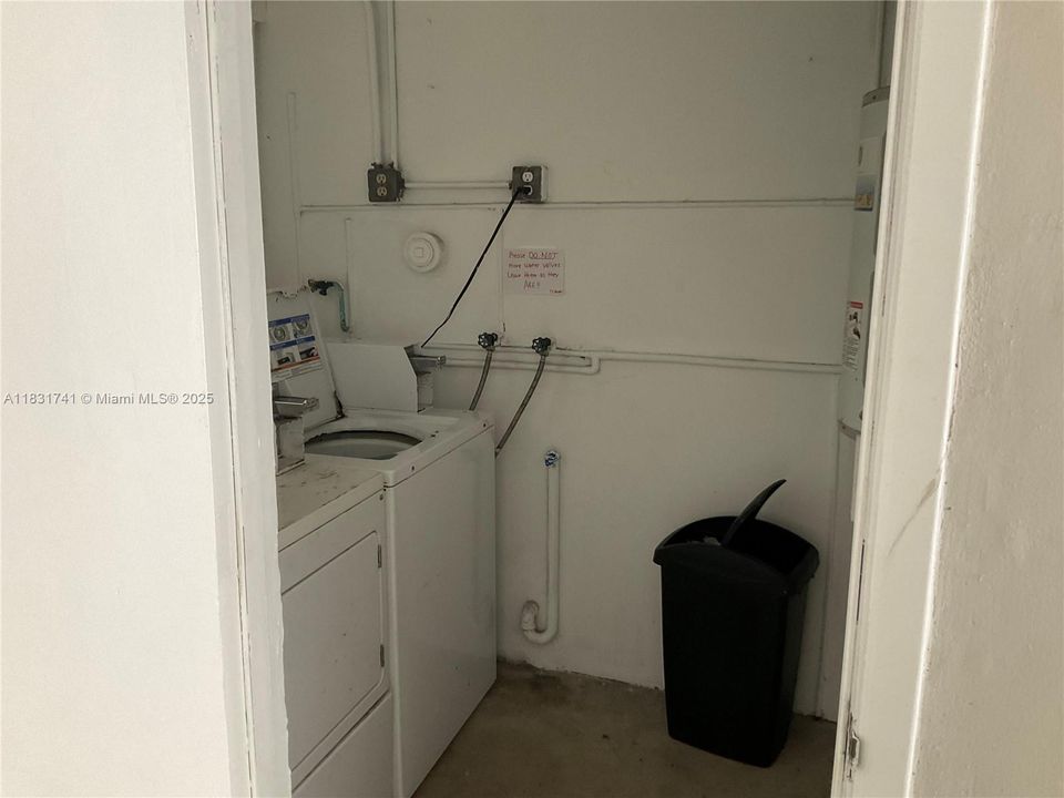 Laundry room direct across from unit