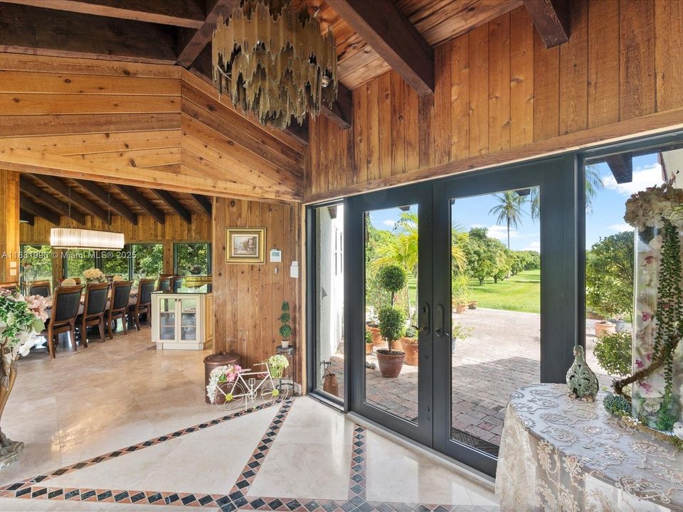 Foyer/Entry, Facing to the East wing of the residence where you have the Kitchen, Great room, Living room and Family Room all under 18 FT vaulted ceilings.