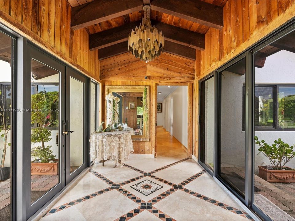 Foyer/Entry, Facing to the West wing of the residence where 4 bedrooms and 2 baths are located.