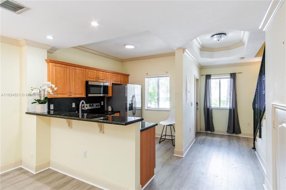 Located at the front of the unit, the kitchen with snack counter is the focal piece of the downstairs living area.
