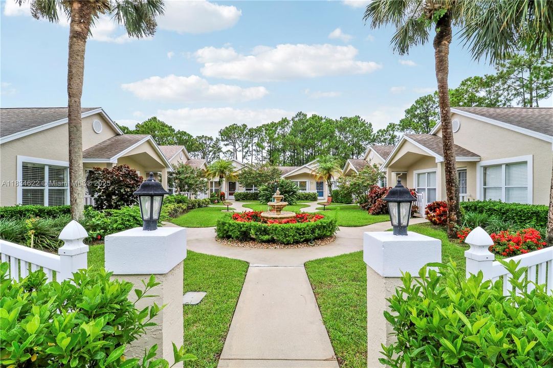 Entry into the villa cluster with view of the fountain
