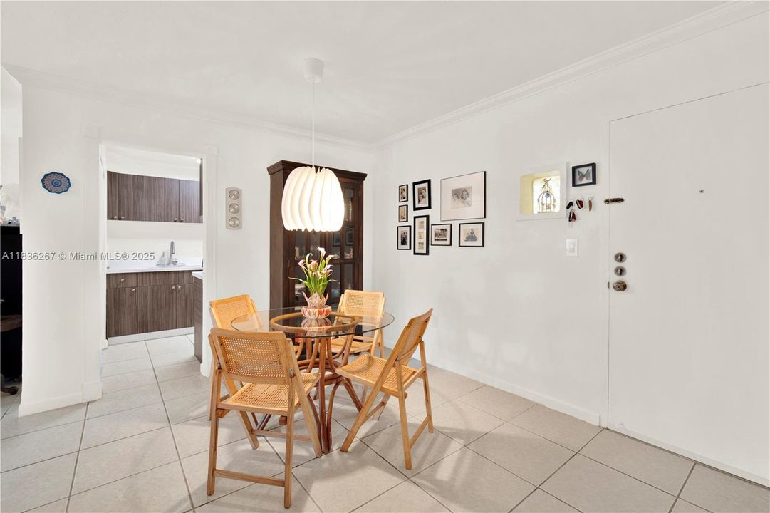Dining room with the kitchen in the background