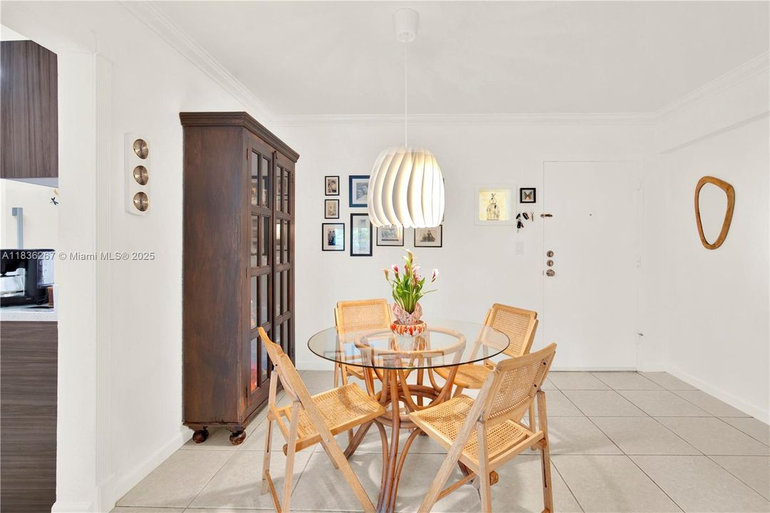 Dining room with the view of the front door in the background