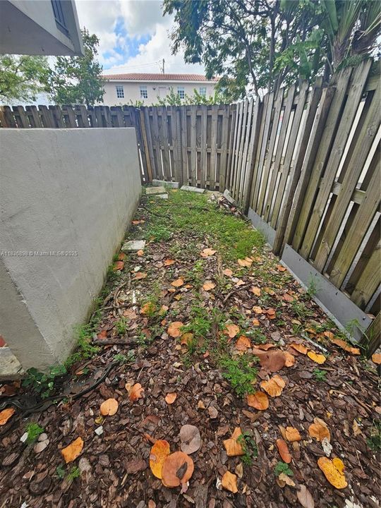 concrete wall plus wooden fence