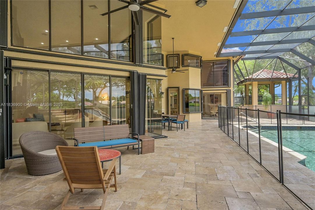 Honed Travertine and A Beautiful Accent to the Multiple Sitting Areas!