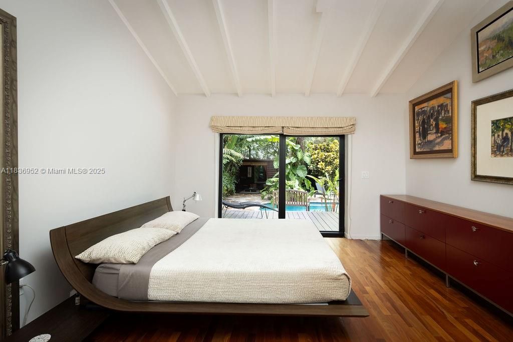 Master Bedroom with view and exit to pool and garden.