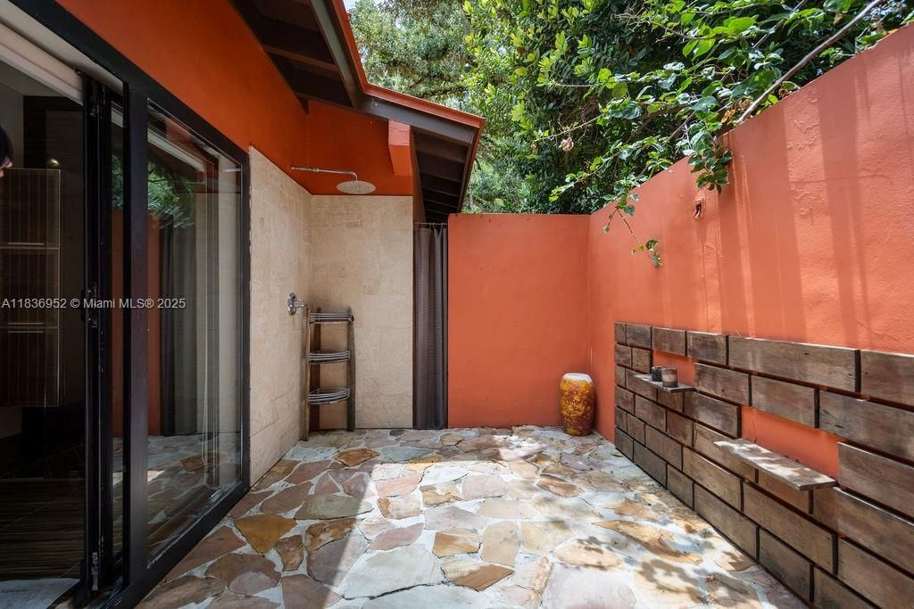 Master bath with exterior shower