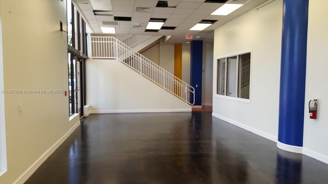 Access to 2nd floor via open staircase.