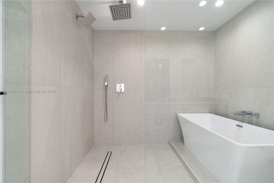 Enclosed shower with soaking tub..
