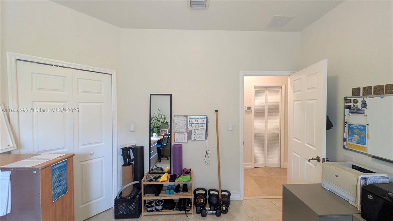 bedroom 2 Approx Measurements 12 x 12.2 +huge walk-in closet 7.7 x 6.11-currently being used as an office