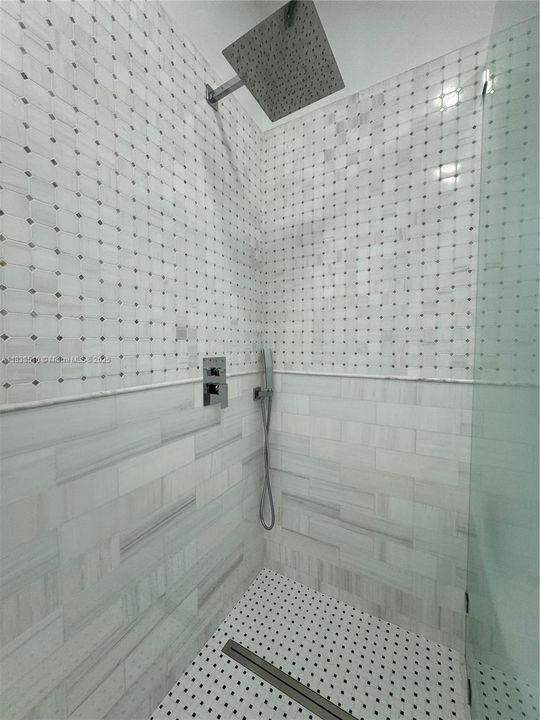 Rainshower and hand-held, linear drain, easy access, frameless glass