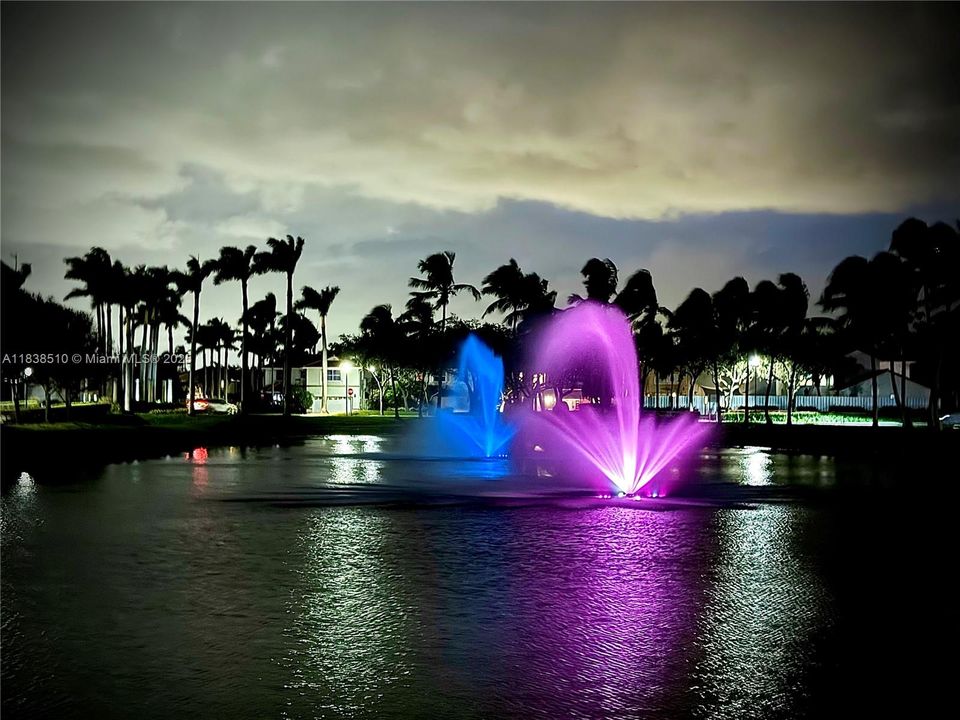 Fountains in lakes with nighttime lighting