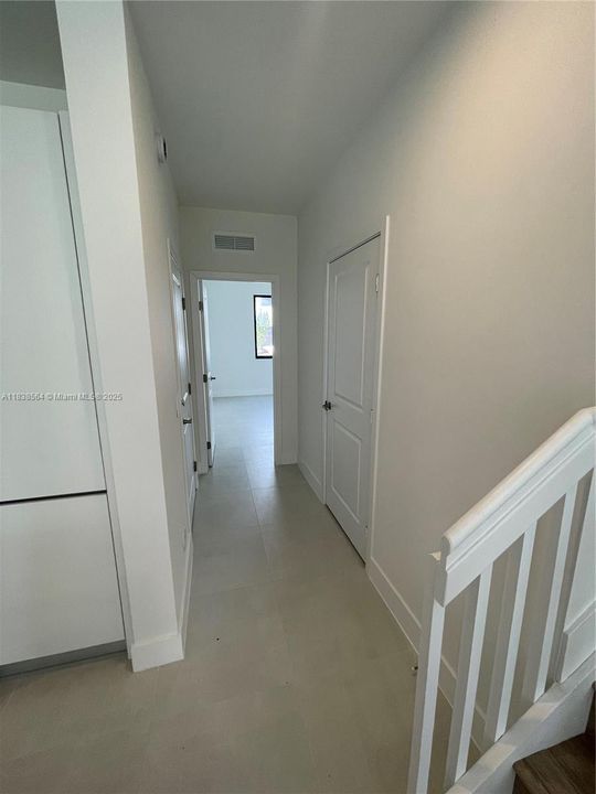 First Floor hallway to garage and 1/1