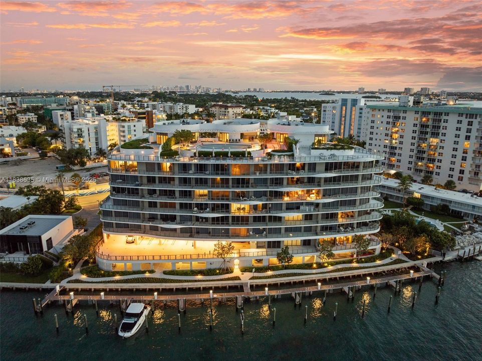 Back of Structure, private marina & boat slip at sunset
