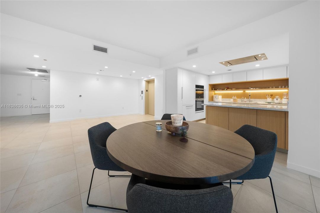 dining/kitchen/elevator/facing den/laundry room/3rd bath