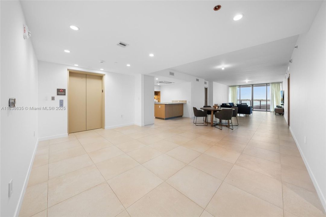 elevator, kitchen, dining, living, master on right, 2nd bedroom & 2nd bath on left