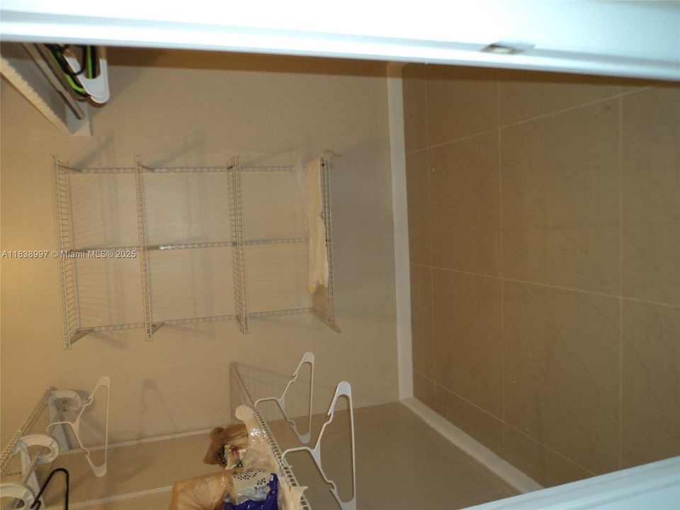 Large Master BDRM Walk in Closet with Closet Organisers