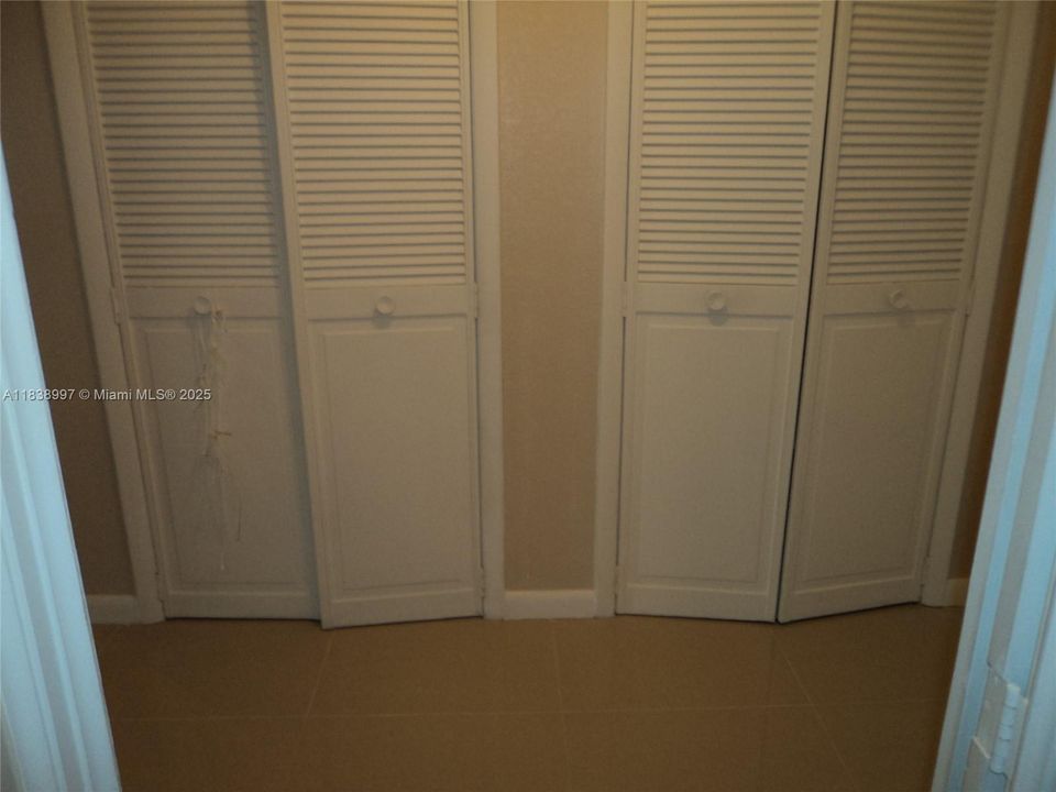 Two Pantry Closets In Foyer of Apartment