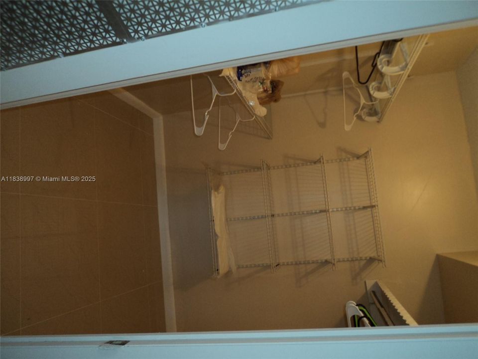 Large Master BDRM Walk in Closet with Closet Organisers