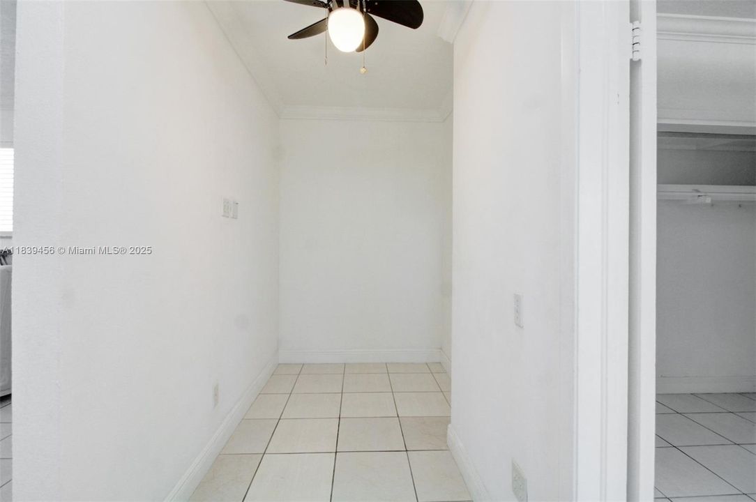 Just outside and adjacent the master and across from bathroom is the large space which could become a walk-in closet or use as a den.