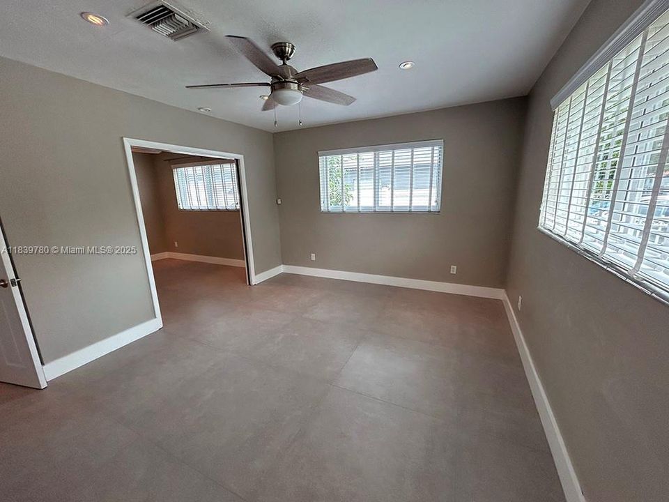 Master bedroom with a connecting door to another bedroom.