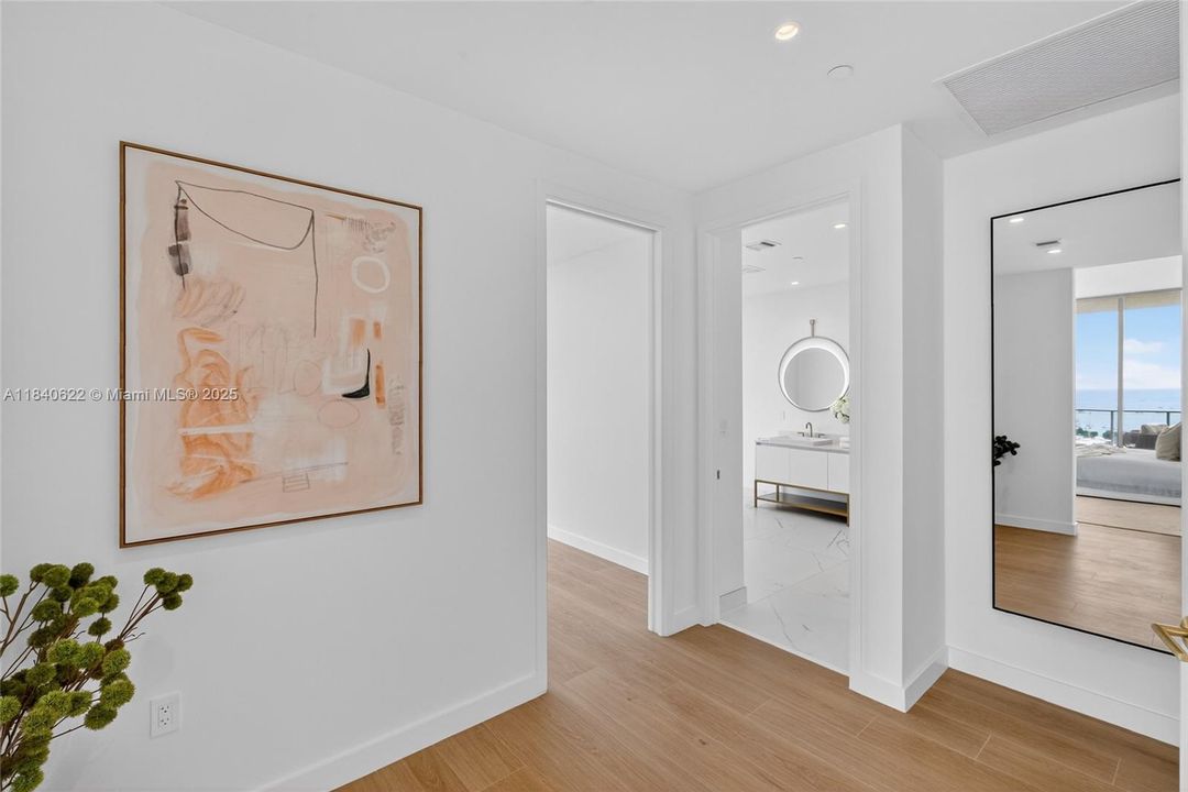 Entrance to Primary Bedroom Closet and Bathroom