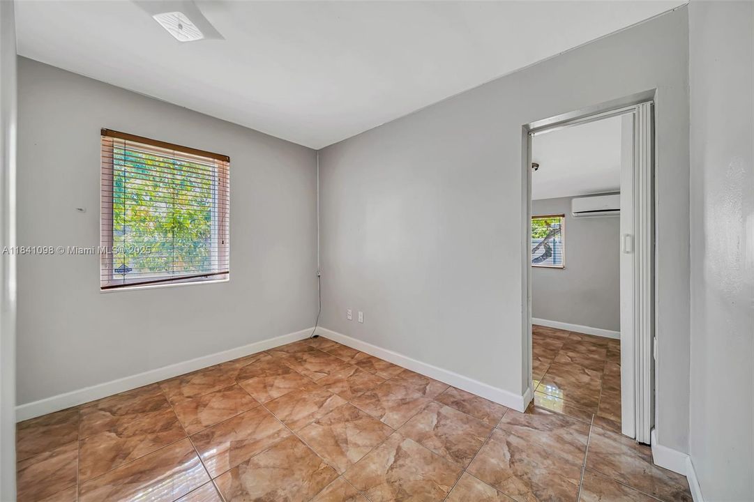 connects to adjacent bedroom through sliding door.