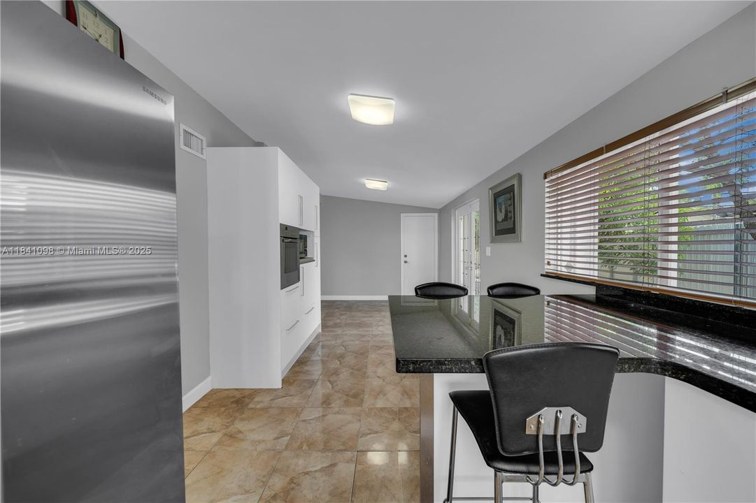 Open concept kitchen with family/dining combination layout.